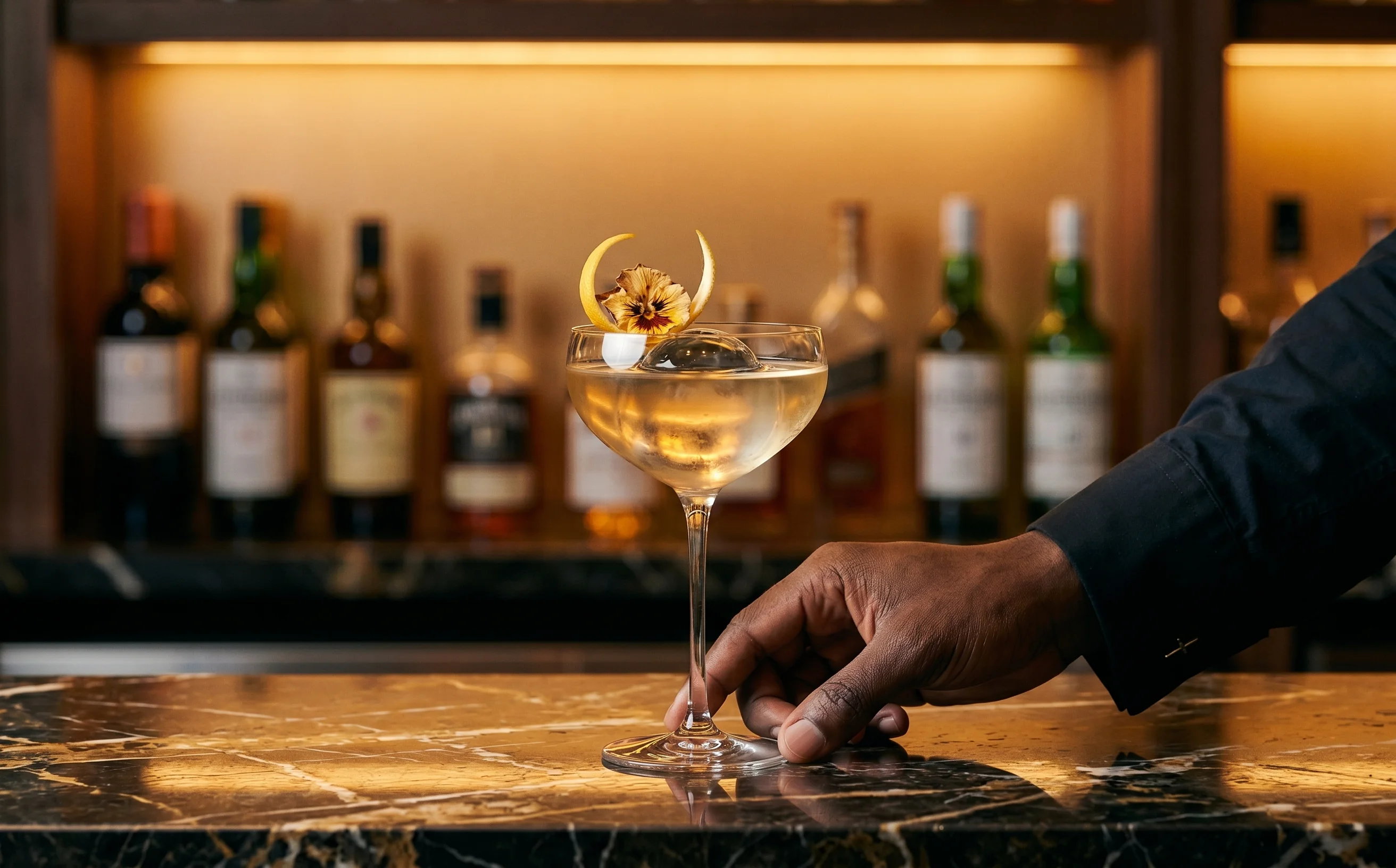 Premium cocktail service at a Liberian hospitality property bar program featuring Canadian craft spirits sourced through the Quality Roots trade corridor